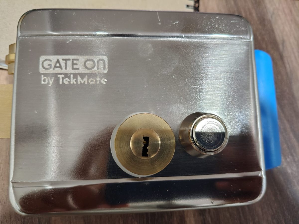 GateOn lock by TekMate — stainless steel body with brass key cylinder and release button